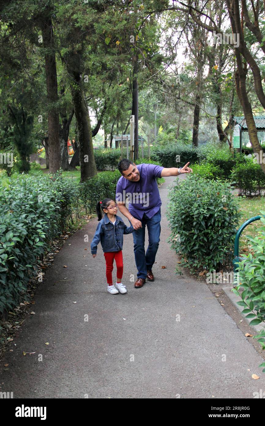 Divorced single dad and brownhaired Latino 4yearold daughter walk in