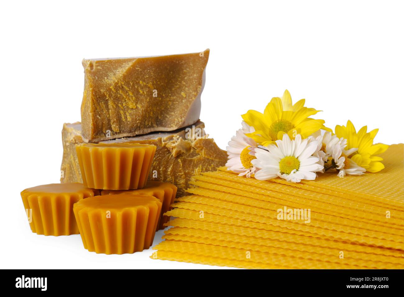 Different natural beeswax blocks, flowers and sheets on white background Stock Photo