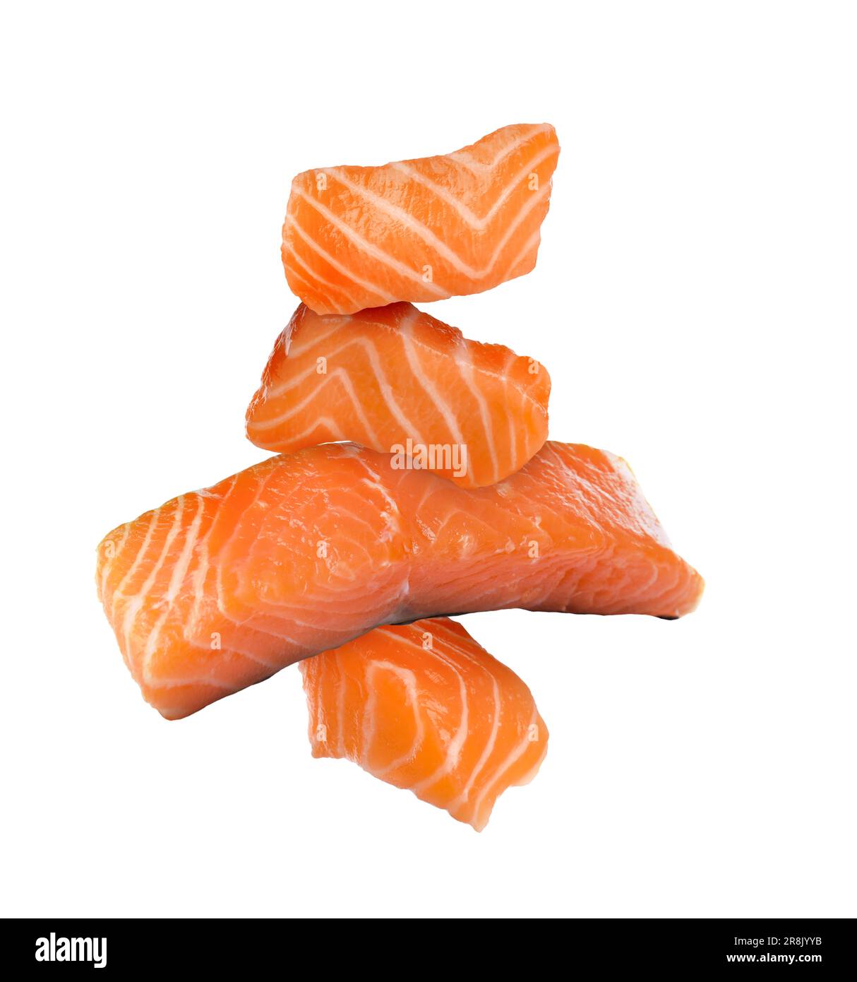 Cut fresh salmon falling on white background Stock Photo - Alamy