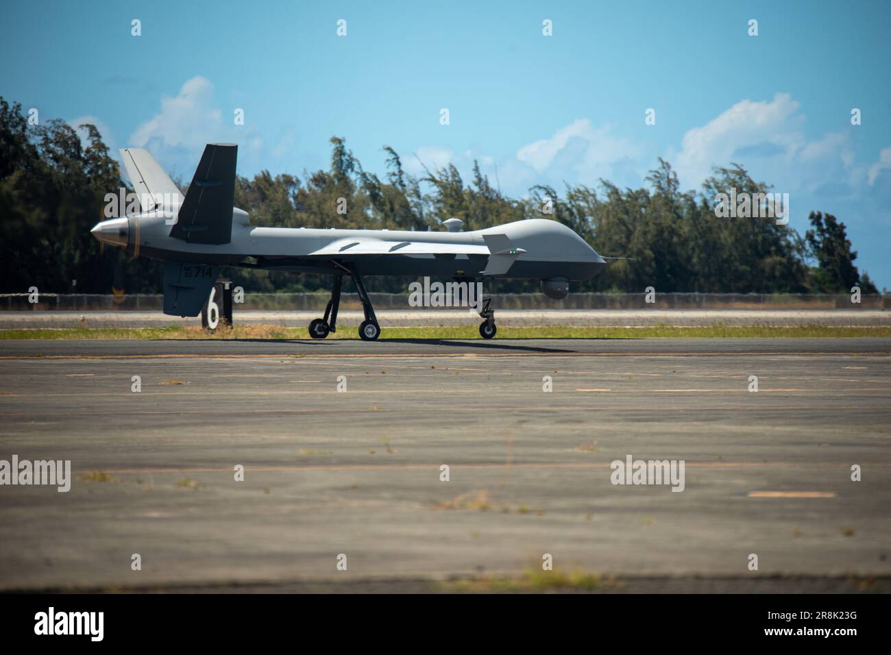 U.S. Marine Corps Marine Unmanned Aerial Vehicle Squadron (VMU) 3, Marine Aircraft Group 24, maneuvers an MQ-9A down the flight line on Marine Corps Air Station Kaneohe Bay, June 20, 2023. The MQ-9A is a remotely piloted aircraft capable of supporting a wide range of operations such as coastal and border surveillance, weapons tracking, embargo enforcement, humanitarian and disaster assistance, support of peacekeeping and counter-narcotic operations. VMU-3 supports the Marine Air-Ground Task Force by providing multi-surveillance and reconnaissance, data gateway and relay capabilities through an Stock Photo