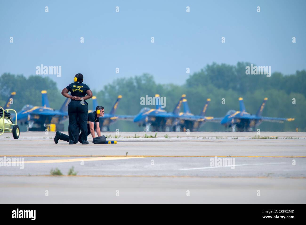 The U.S. Navy Blue Angels crew chiefs prepare for post flight activities after a performance on the flight line at Rickenbacker Air National Guard Base during the Columbus Airshow, June 17, 2023. The event featured more than 20 military and civilian planes, including a KC-135 Stratotanker from the 121st Air Refueling Wing, which served as the base of operations for military aircraft participating in the show. (U.S. Air National Guard photo by Tech. Sgt. Wendy Kuhn) Stock Photo