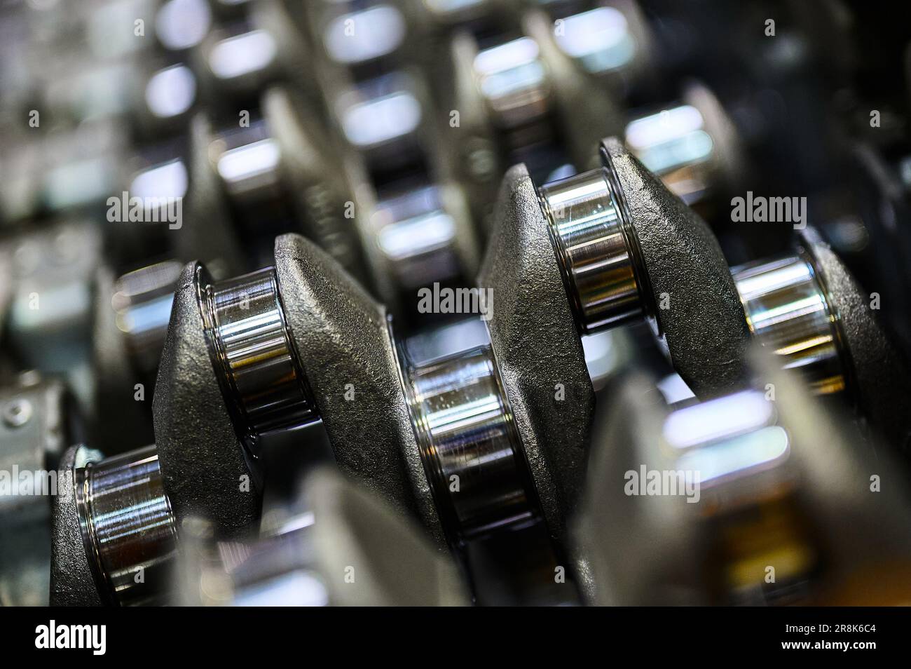 Crankshaft of an automobile engine closeup. Polished shaft journals