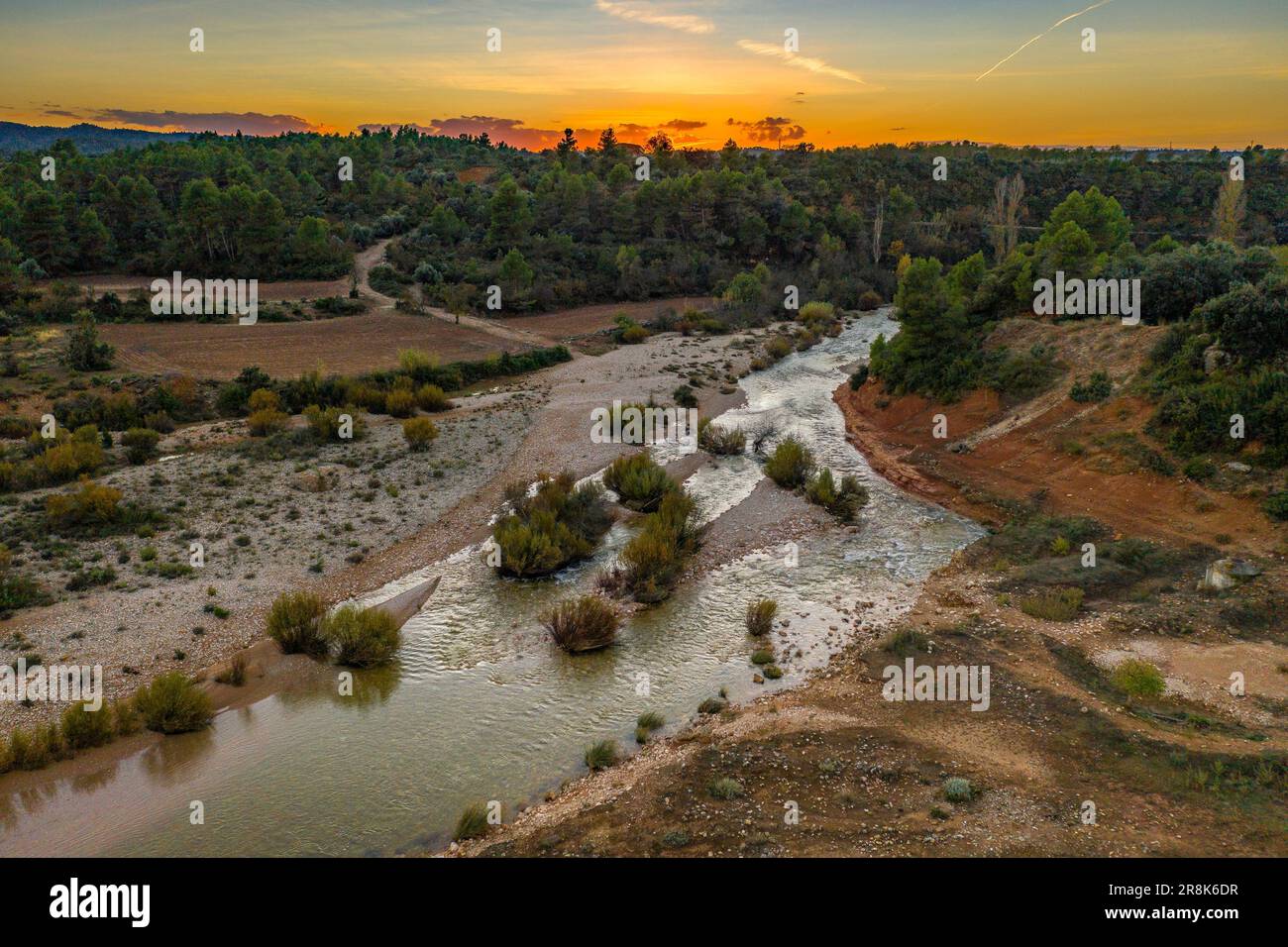 Aerial view of the Algars river as it passes through Arnes, on an autumn sunset (Terra Alta Tarragona Catalonia Spain) ESP: Vista aérea del río Algars Stock Photo
