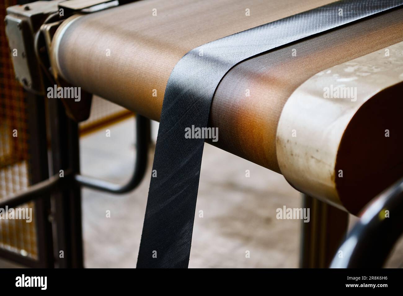 Rubber ribbon reinforced with textile on conveyor at factory Stock ...