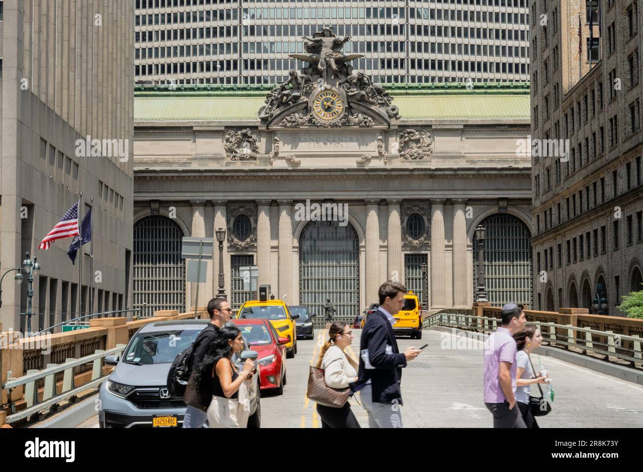 Pedestrians use the crosswalk at 40th St. in front of Grand Central terminal, 2023, New York City, USA Stock Photo