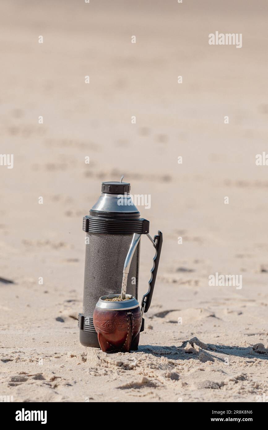 https://c8.alamy.com/comp/2R8K8N6/typical-mate-taken-in-argentina-uruguay-paraguay-and-brazil-accompanied-the-thermos-in-the-beach-in-2023-2R8K8N6.jpg