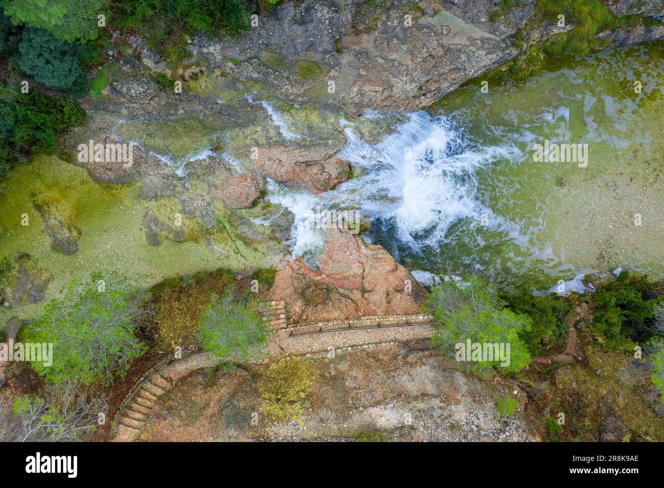 Zenithal aerial view of the Toll del Vidre in the Algars river, in the Els Ports / Los Puertos natural park, with a large flow after heavy rains Stock Photo