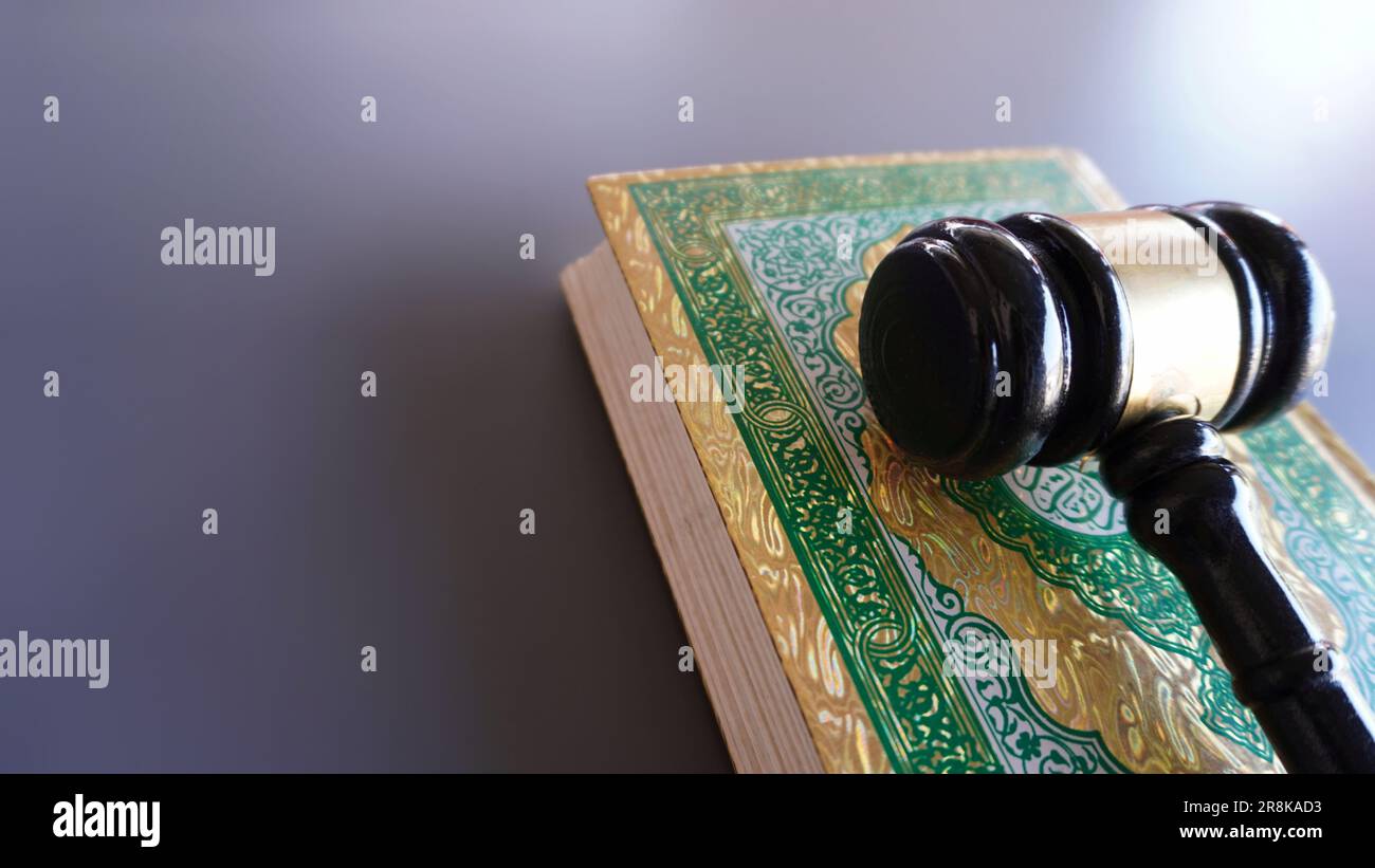 Gavel and Quran with copy space. Sharia or Islamic law concept Stock Photo