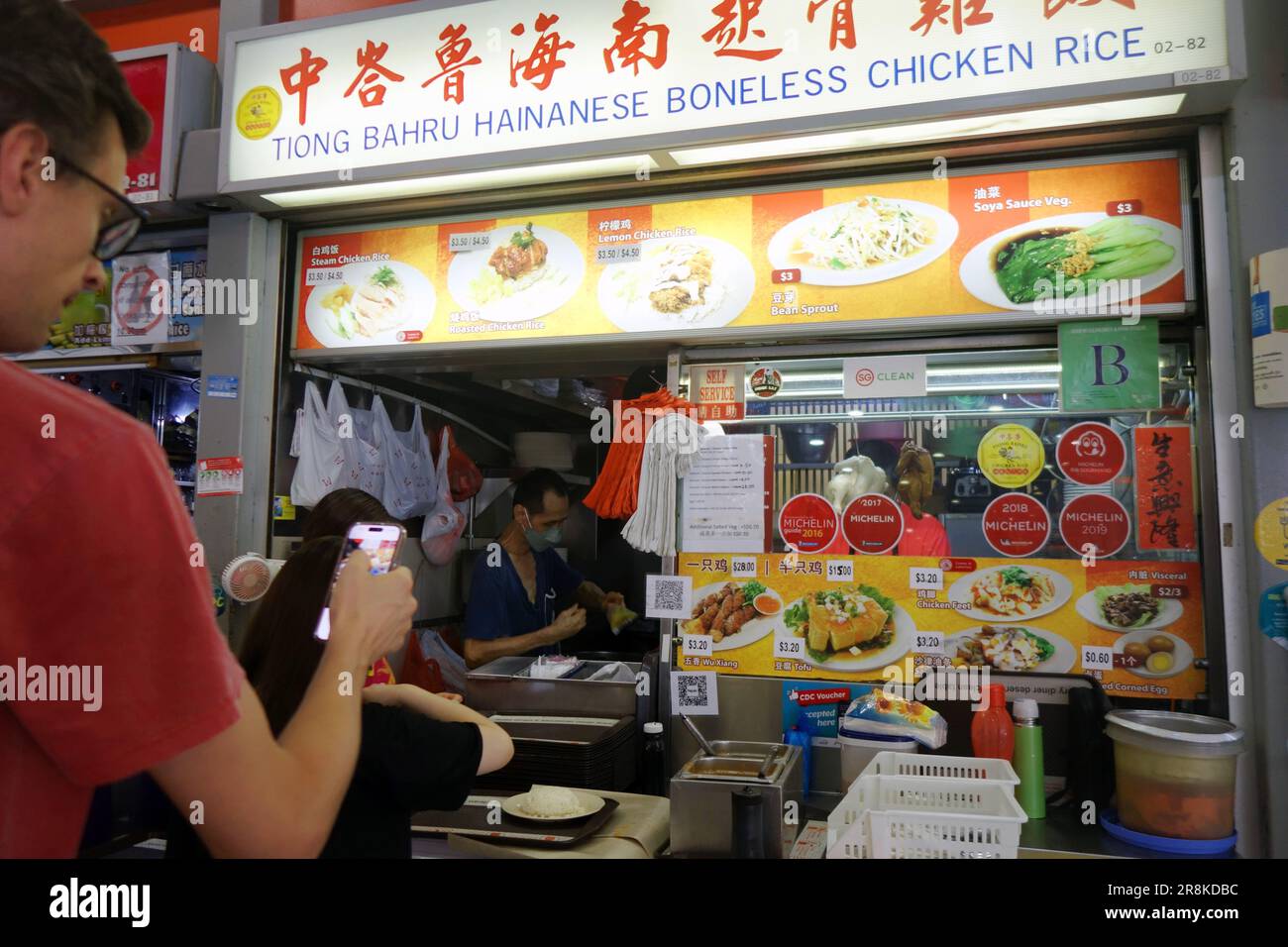 Tiong Bahru Hainanese Boneless Chicken Rice stall with Michelin Guide stickers, Tiong Bahru Hawker Food Centre, Singapore. No MR or PR Stock Photo