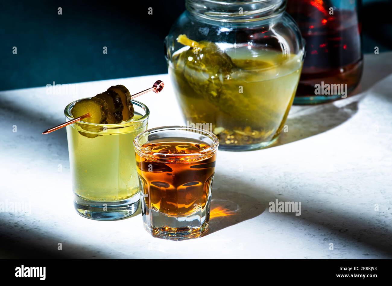 Pickleback, alcoholic cocktail drink from cucumber pickle and whiskey ...