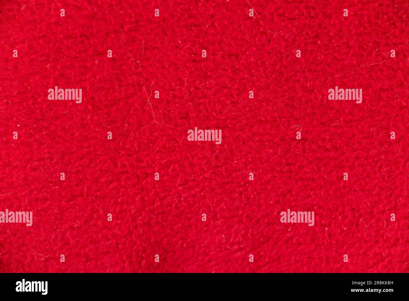 light red background terry synthetic blanket close-up Stock Photo