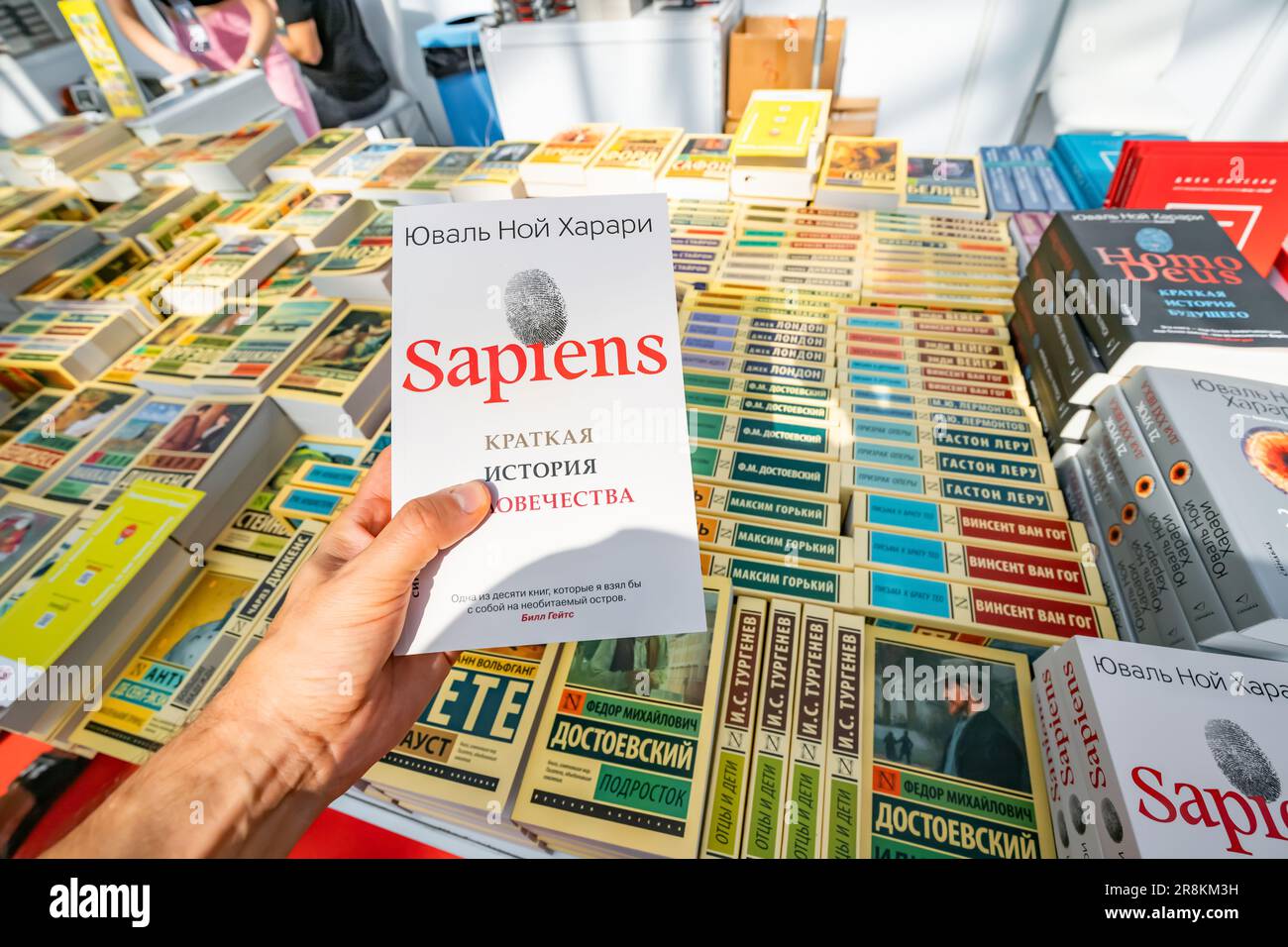 28 October 2022: Antalya, Turkey: Sapiens Harari in russian books at fair and festival. Literature sale and education concept Stock Photo