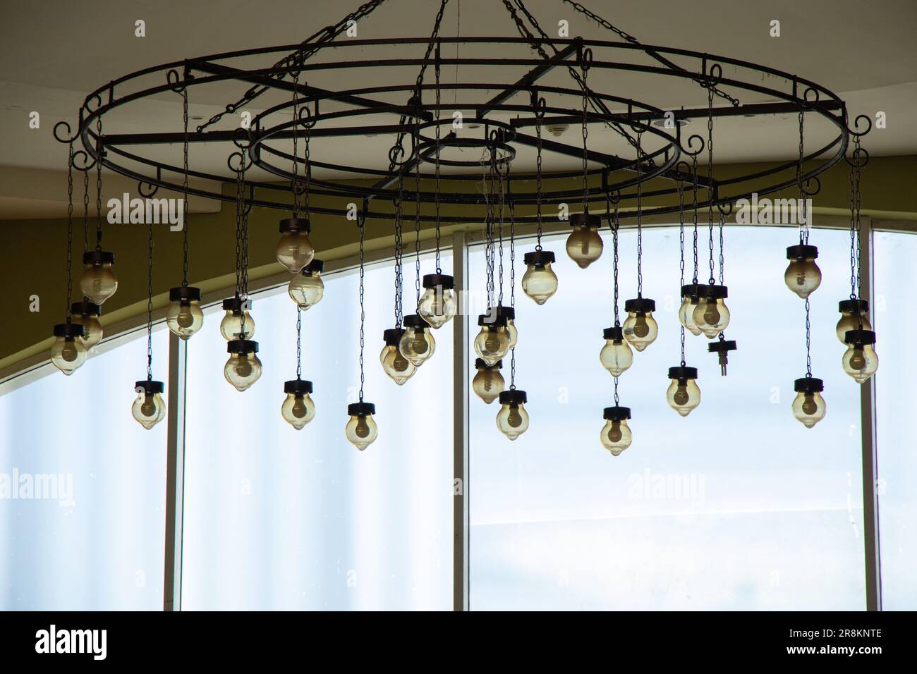 old vintage chandelier hanging on the ceiling of a hotel in egypt close-up Stock Photo