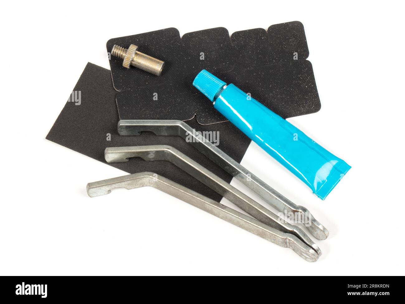 Bicycle flat tire repair kit, isolated on white Stock Photo - Alamy