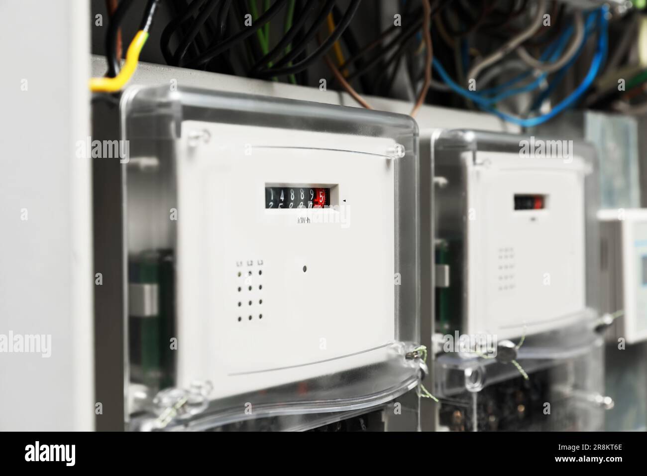 Electric meters and wires in fuse box, closeup Stock Photo Alamy