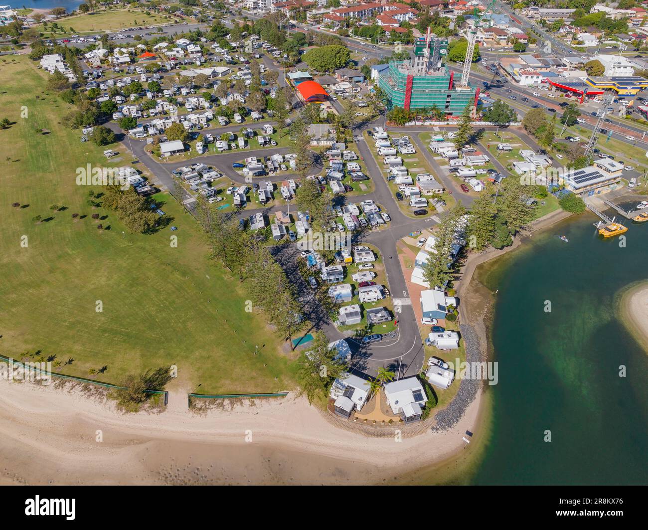 Aerial view of a coastal tourist park and adjacent parkland with building developments at Southport on the Gold Coast at Queensland in Australia Stock Photo