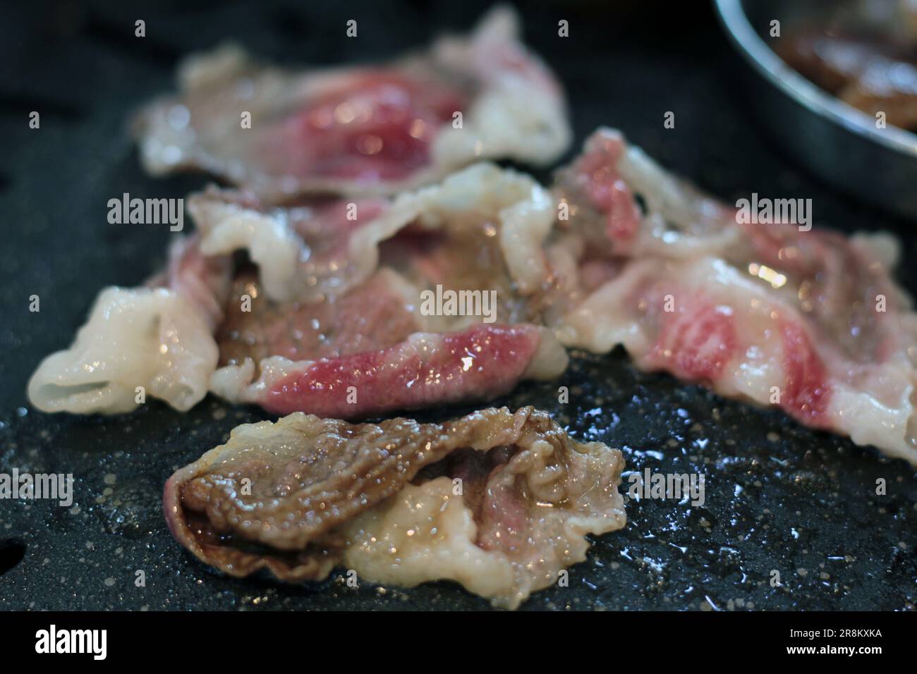 Korean pork ribs and beef marbled Korean BBQ style charcoal grill Stock Photo