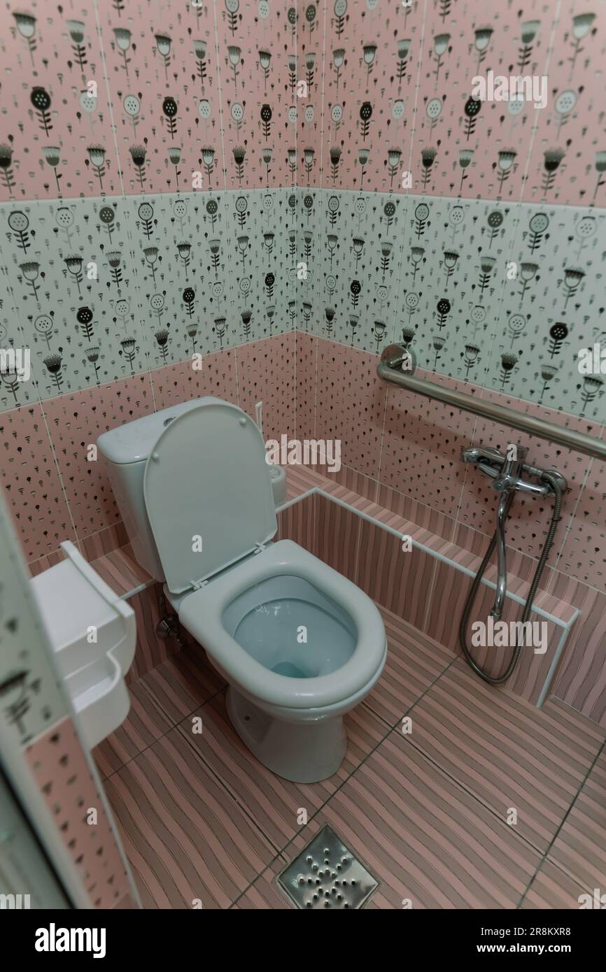 Image of inside freshly cleaned handicap toilet in a hospital, clinic