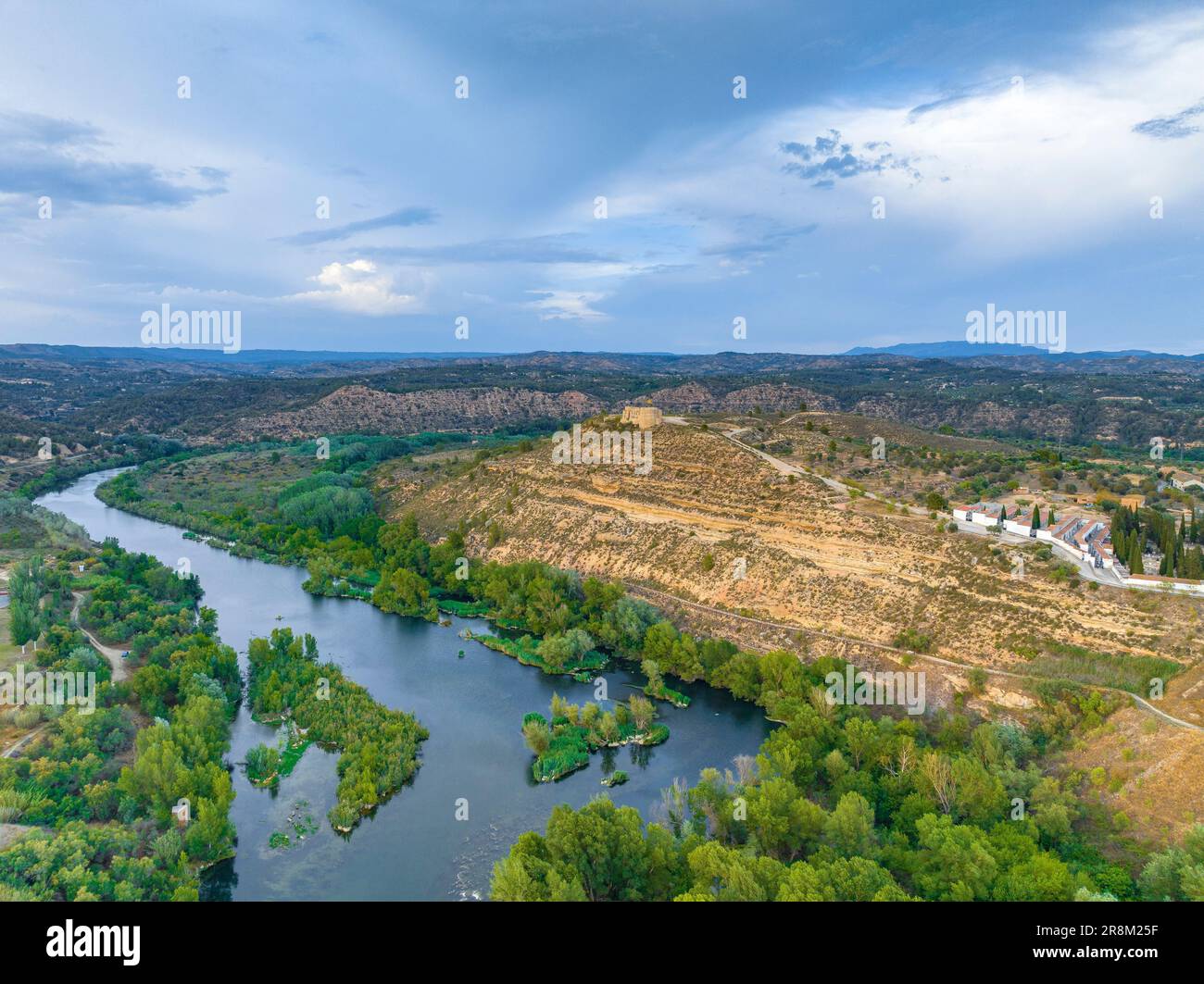 Aerial view of the meander of Flix with the castle on the top of the hill (Ribera de Ebro, Tarragona, Catalonia, Spain) ESP: Vista aérea del río Ebro Stock Photo