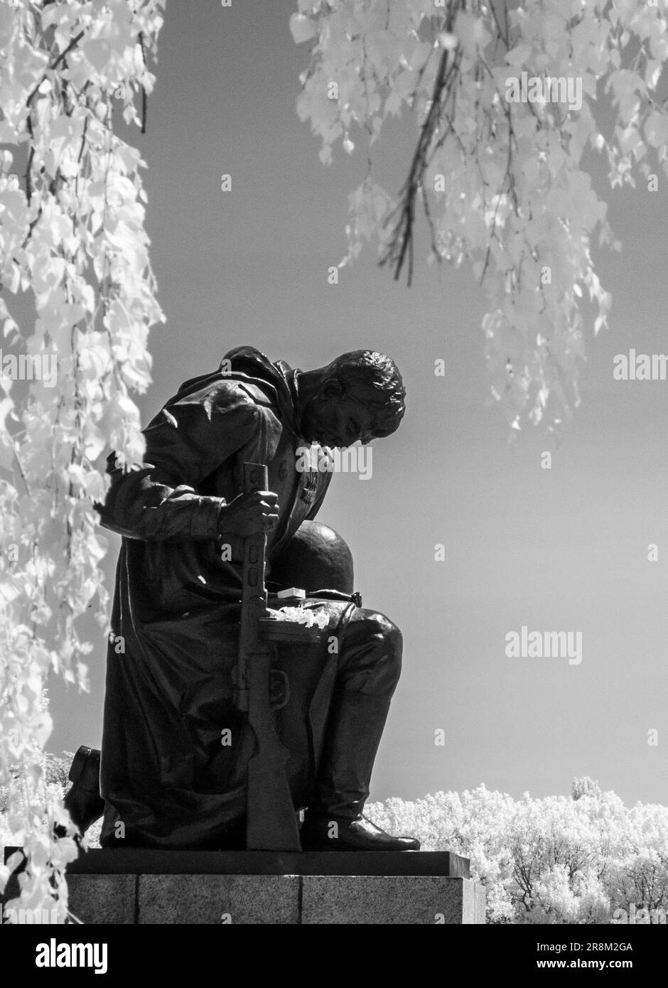 Statue of kneeling Soviet soldier at Soviet war memorial, Treptower