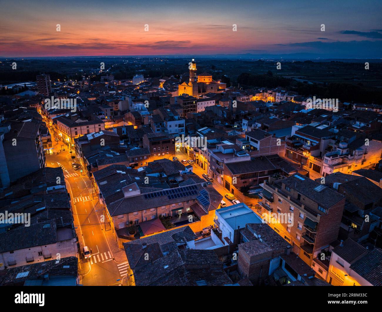 Aerial view of the city of Les Borges Blanques at twilight and at night (Les Garrigues, Lleida, Catalonia, Spain) ESP Vista aérea de las Borges Lérida Stock Photo