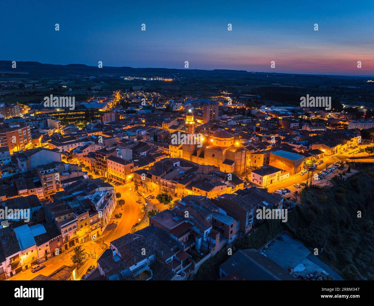 Aerial view of the city of Les Borges Blanques at twilight and at night (Les Garrigues, Lleida, Catalonia, Spain) ESP Vista aérea de las Borges Lérida Stock Photo