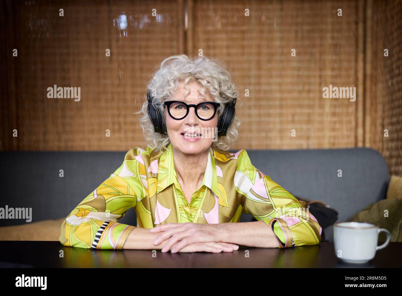Portrait of senior woman wearing headphones Stock Photo