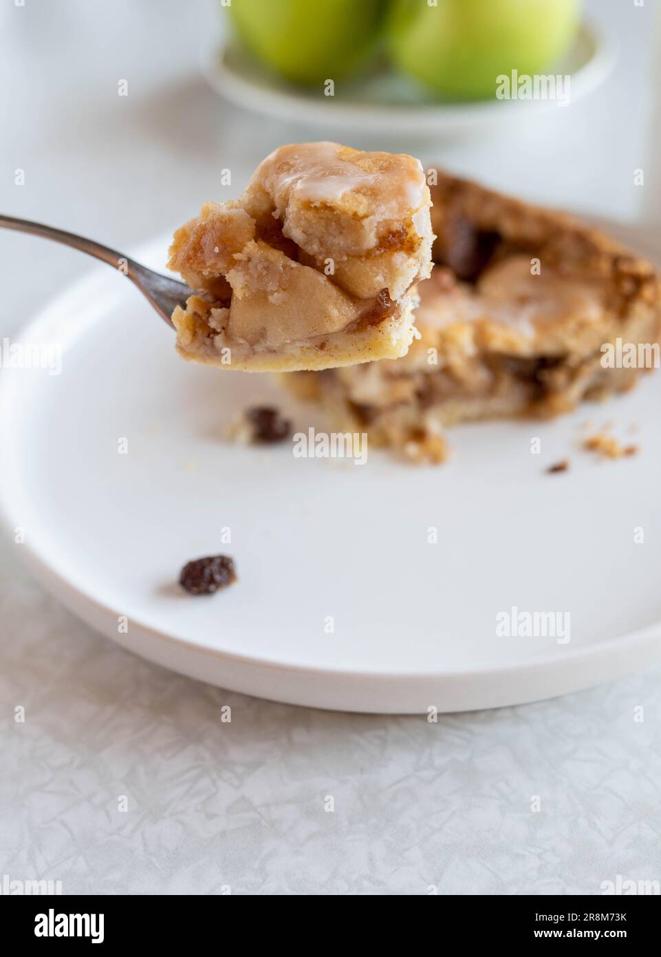 A bite of apple pie on a fork Stock Photo