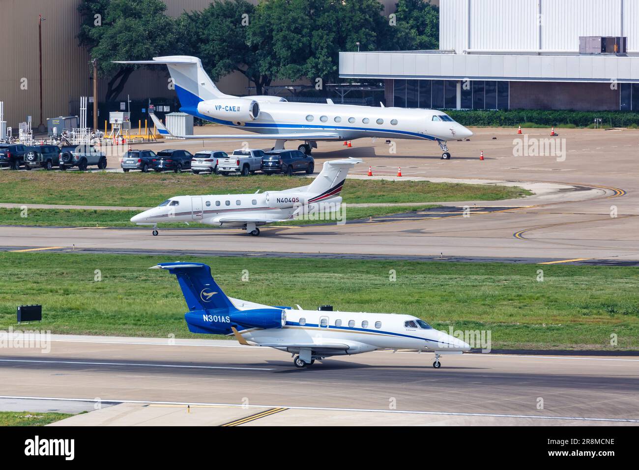 Dallas, United States - May 7, 2023: Embraer Phenom 300 and Gulfstream G550 private jets airplanes at Dallas Love Field Airport (DAL) in the United St Stock Photo