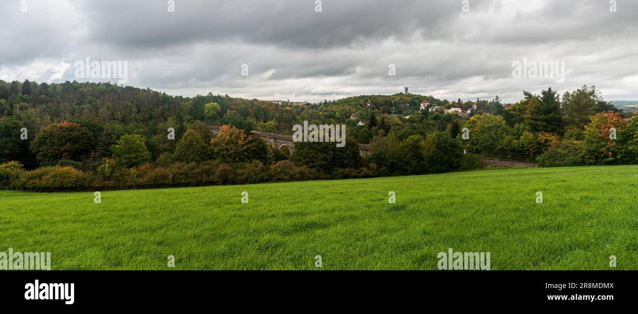 Syratalbrucke with Barenstein hill with lookout tower on the background in Plauen city in Germany during early autumn Stock Photo