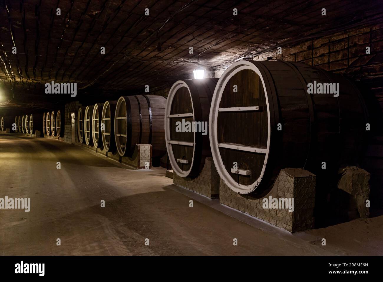 Old large barrels of wine in the cellars of a winery Stock Photo