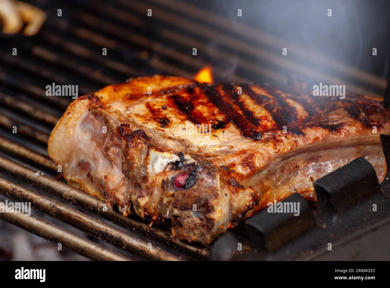 delicious grilled meat. grilling steak on flaming grill Stock Photo Alamy