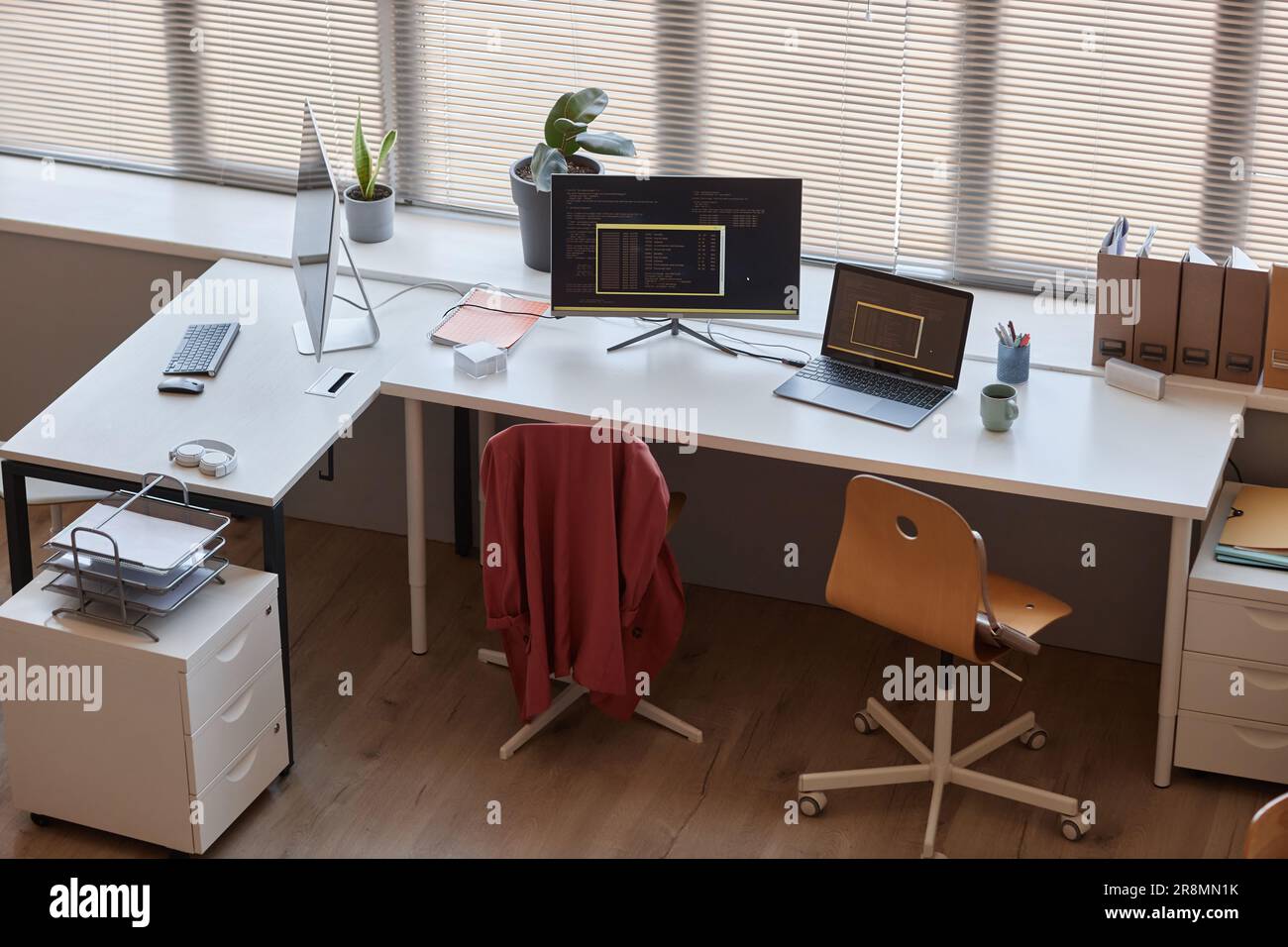 High angle view at modern office workplace with two computers on table, IT programming concepts Stock Photo