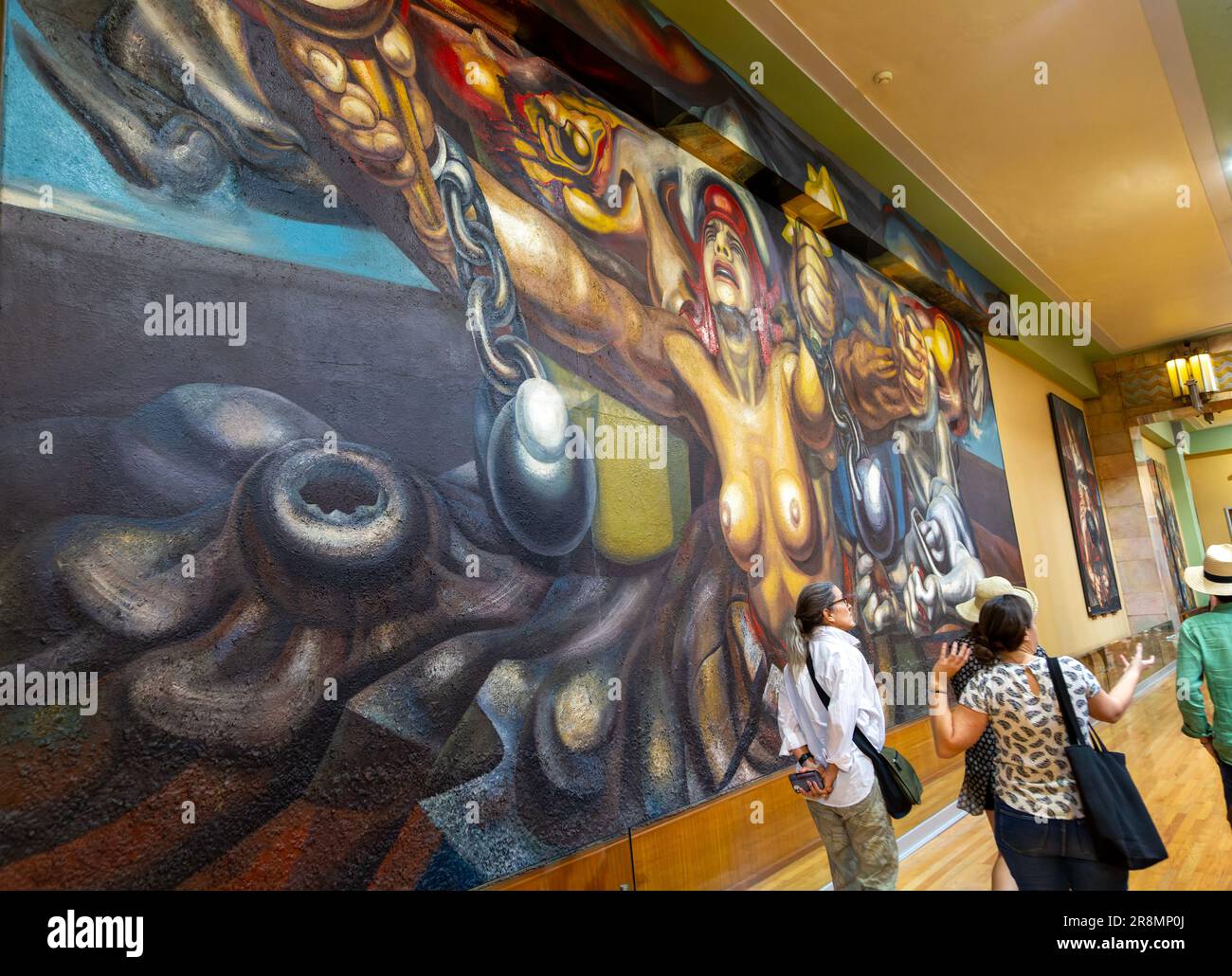 People viewing artwork 'Nueva Democracia' 1944 mural by David Alfaro Siqueiros, Palacio de Bellas Artes, Palace of Fine Arts, Mexico City, Mexico Stock Photo