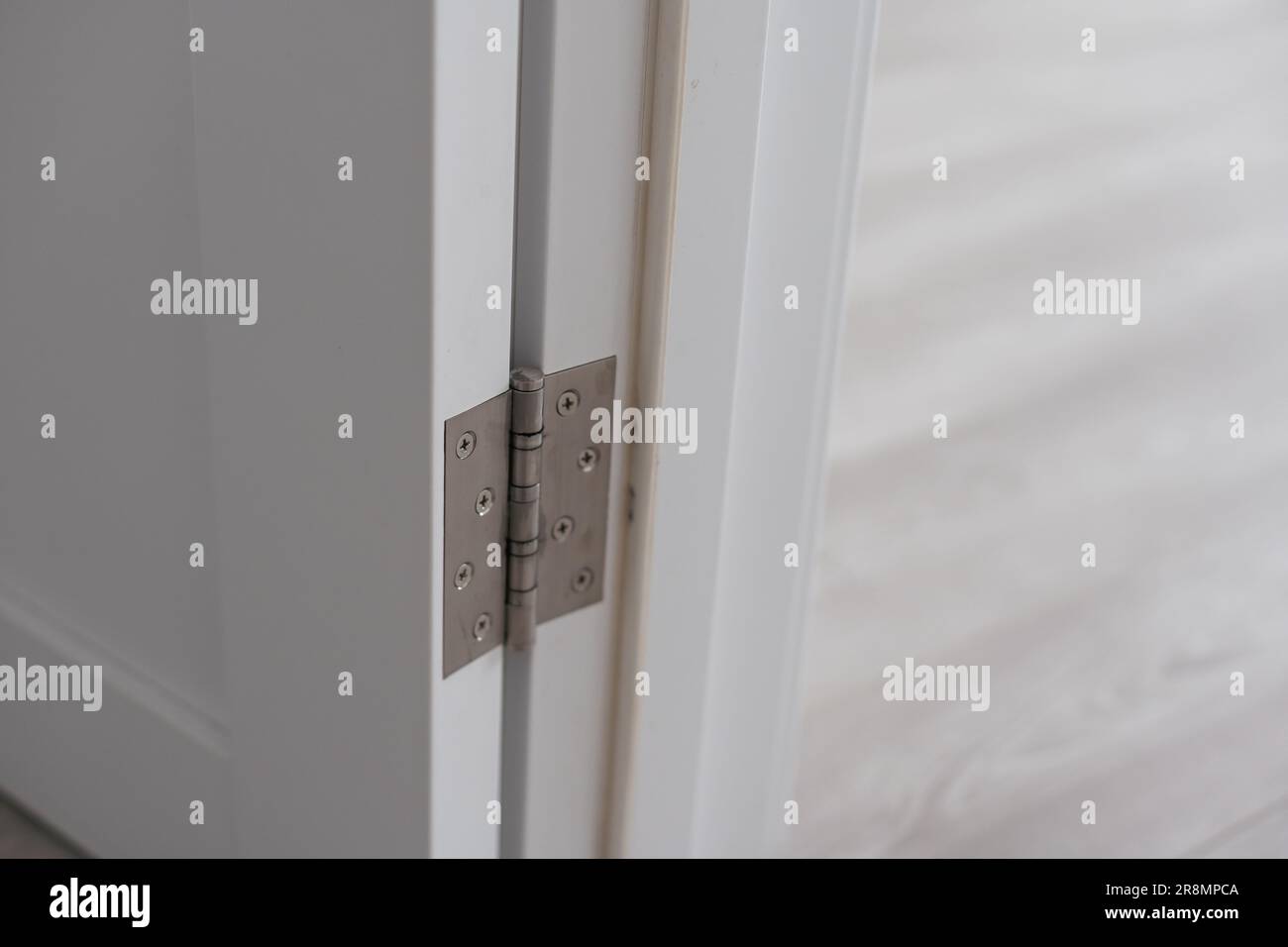 Door hinges. Hinges for wooden doors in the interior Stock Photo Alamy