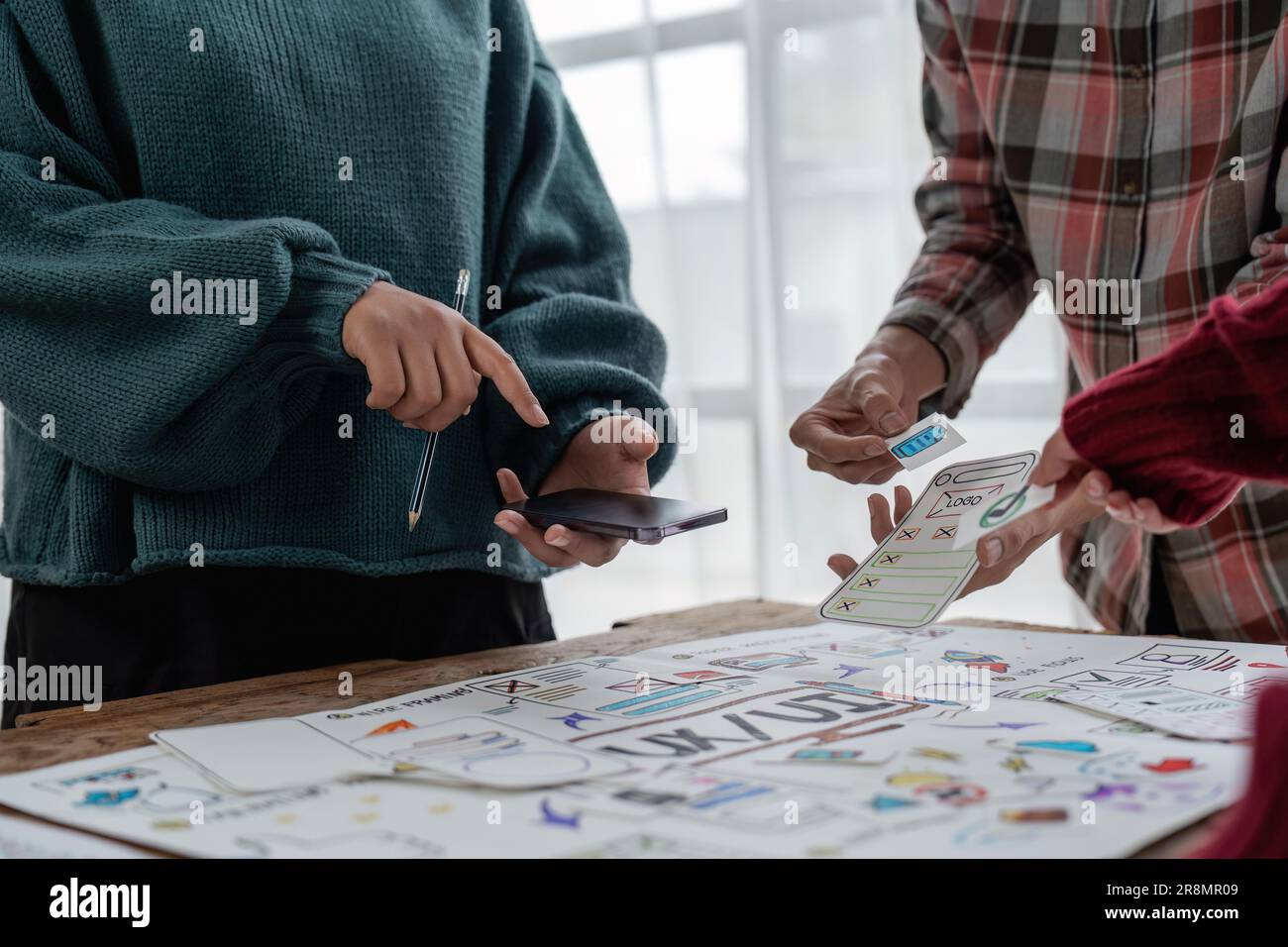 The web designer team is helping to design applications for mobile ...