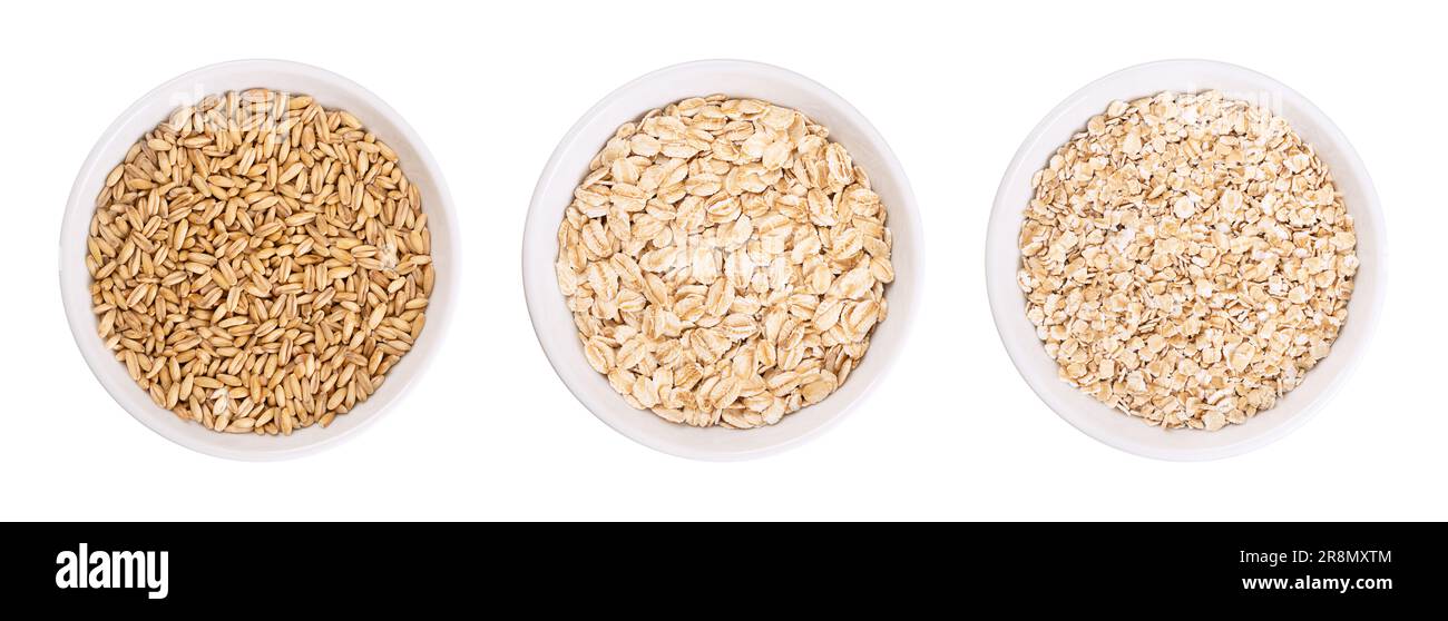 Oat grains, rolled oats and oatmeal, in white bowls. Husked common oat, Avena sativa, a cereal grain. Dehusked steamed oat groats, rolled into flakes. Stock Photo