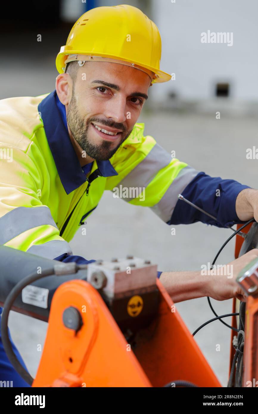 Tractor Engineer tractor inspection engineer looking at the camera Stock Photo - Alamy