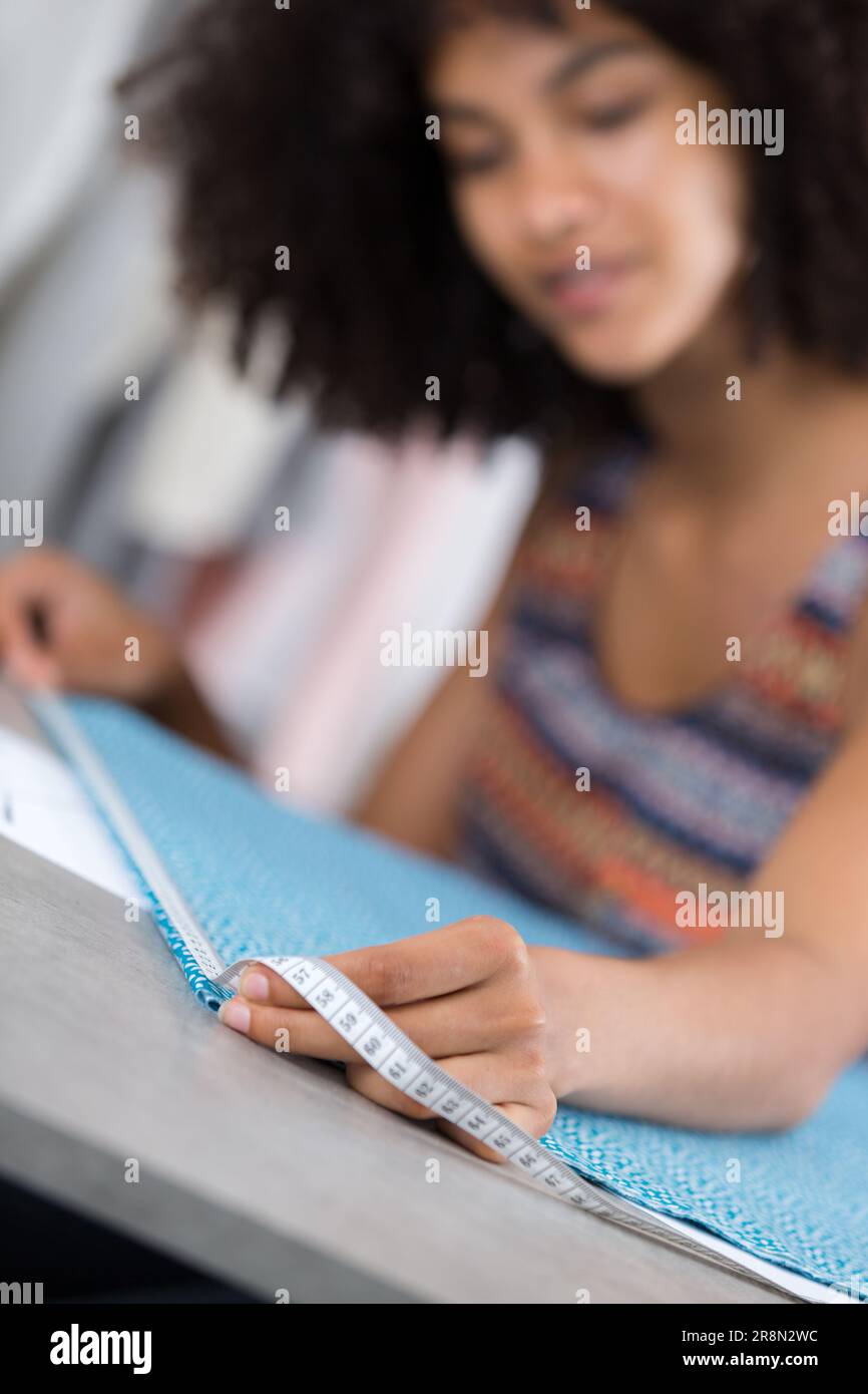 young-tailor-measuring-fabric-stock-photo-alamy