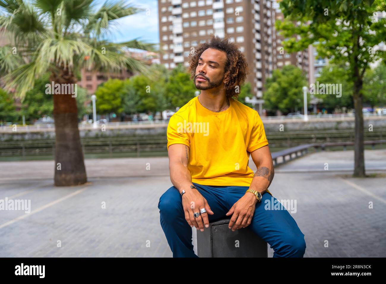 Man in yellow t shirt hi-res stock photography and images - Alamy