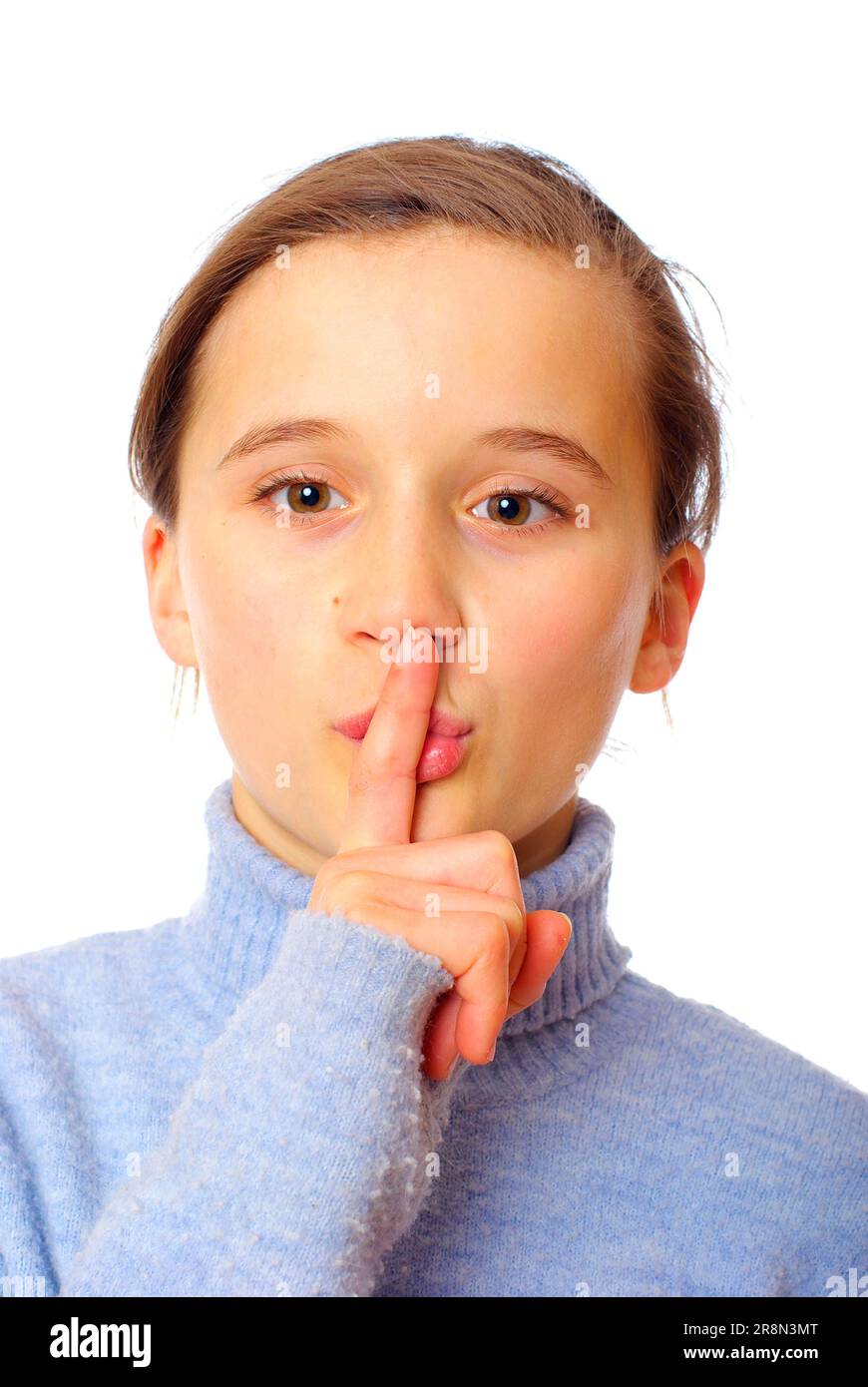 Girl with index finger in front of mouth shh be quiet silence don t