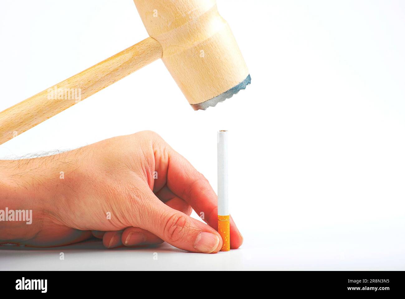 Cigarette is smashed with hammer, give up, stop, harmful, unhealthy Stock Photo