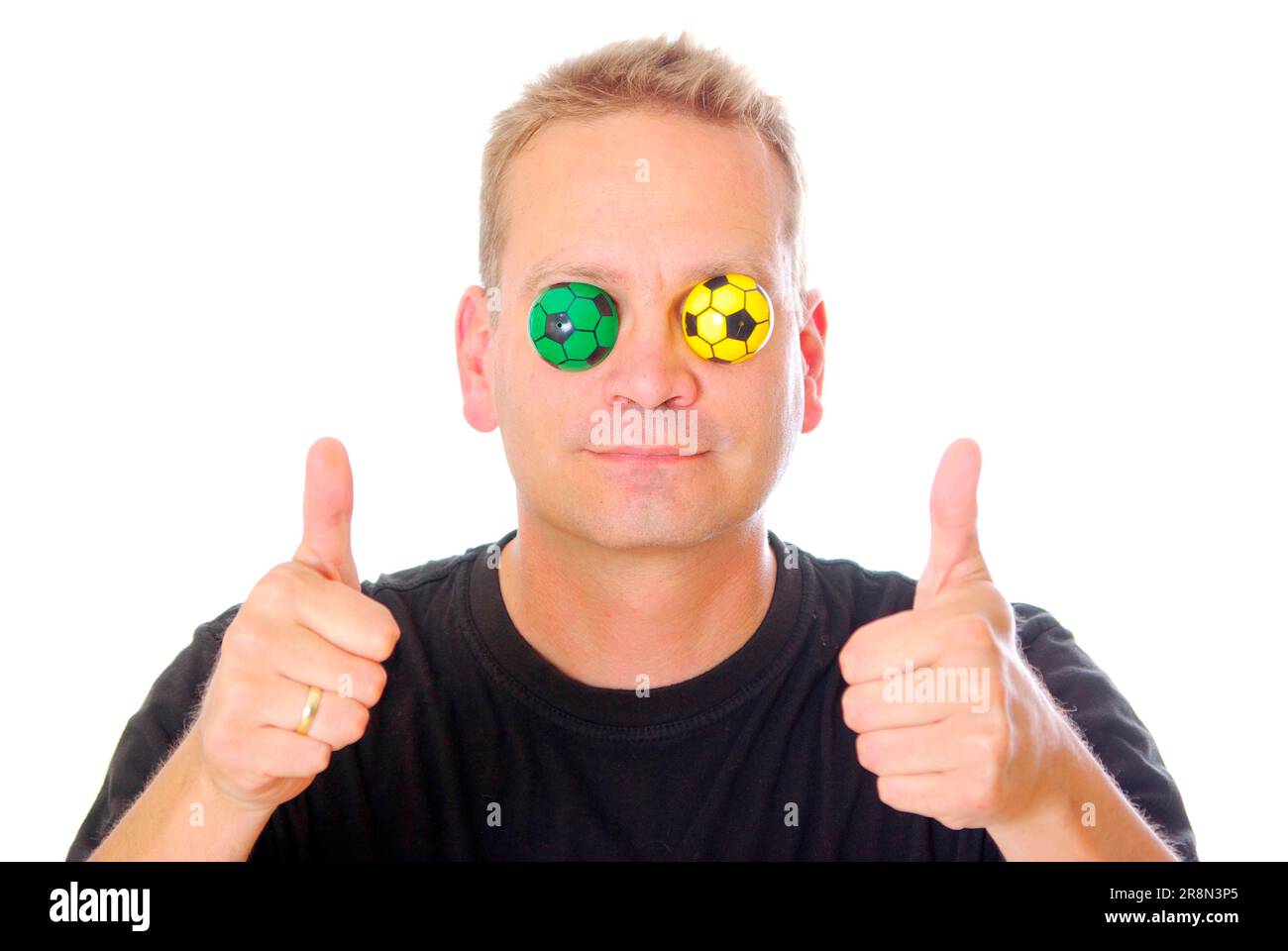 Man with little footballs on his eyes, football fan, thumbs up, thumbs