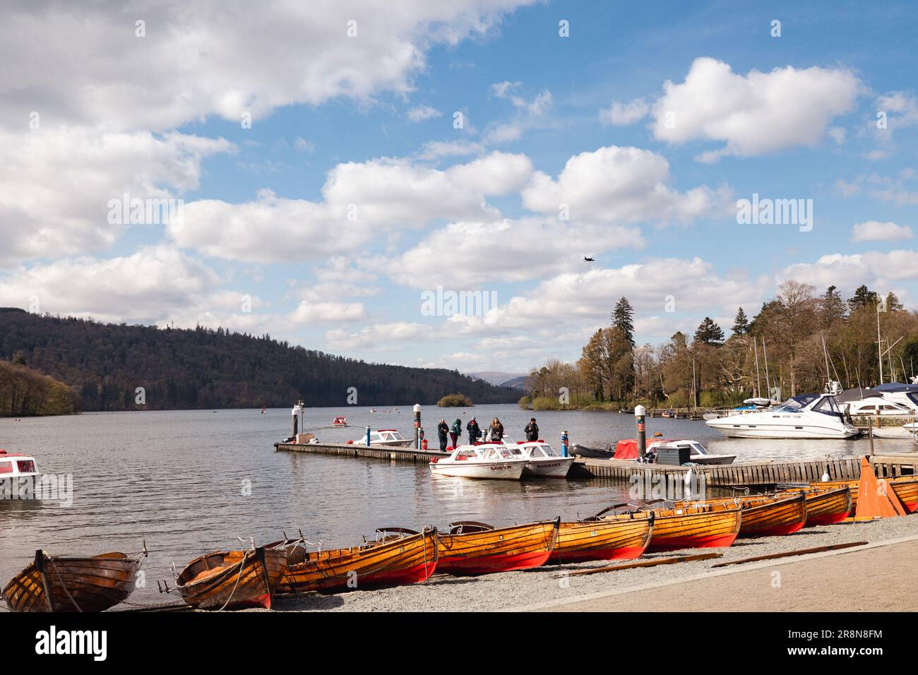 Bowness Bay on Lake Windermere & traditional clinker wooden rowing boats hire Stock Photo Alamy
