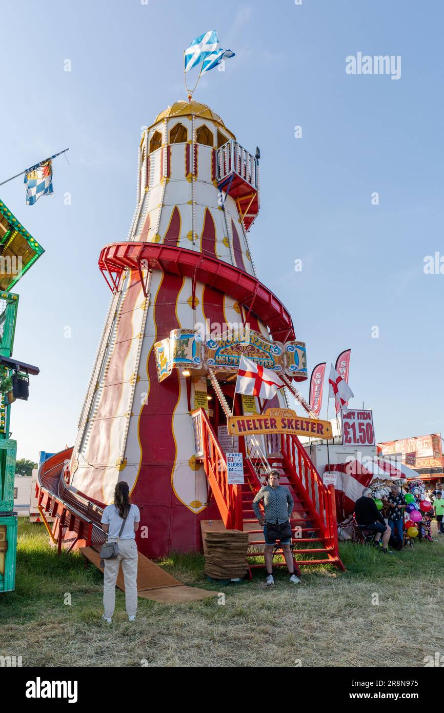 Traditional Helter Skelter children's ride at The Hoppings funfair, fairground or showground in Newcastle upon Tyne, UK. Stock Photo