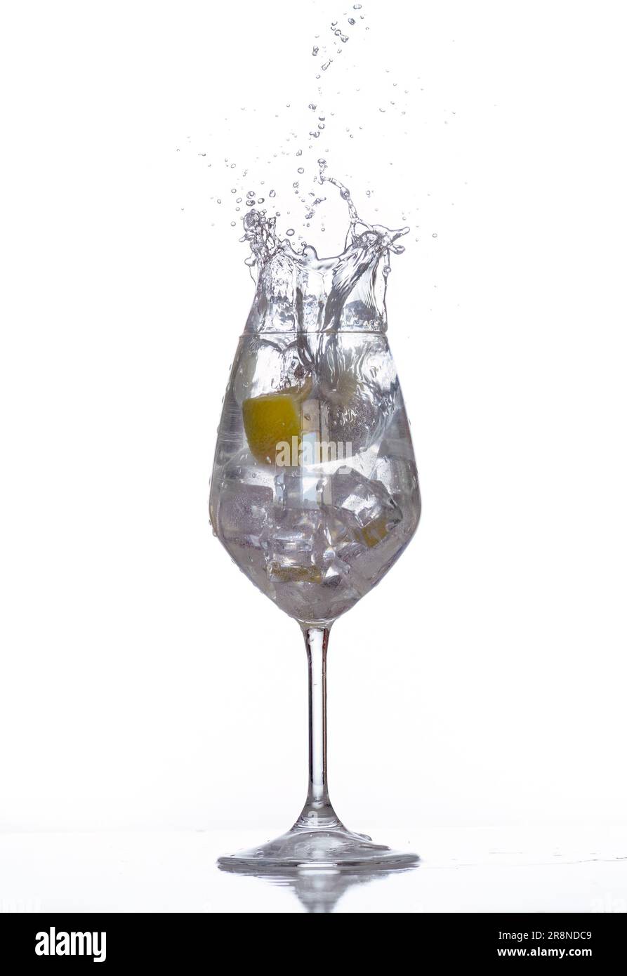 Splash photography with a lemon inside water and ice. Stock Photo