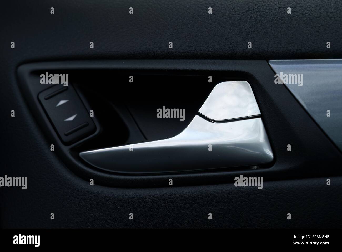 Car interior door handle with controls for electric windows Stock Photo Alamy