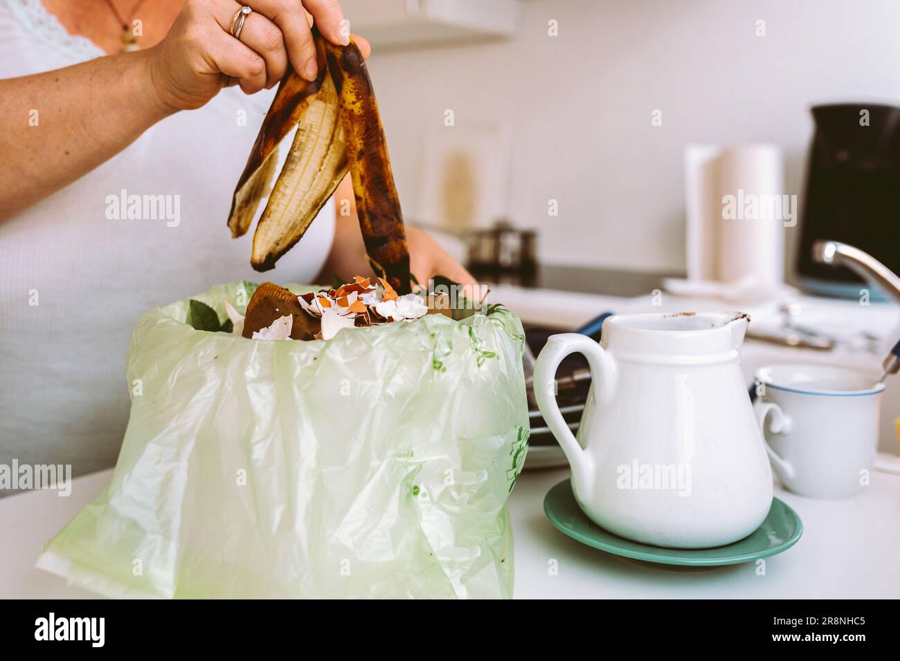 Leftover food in trash can in kitchen Stock Photo Alamy