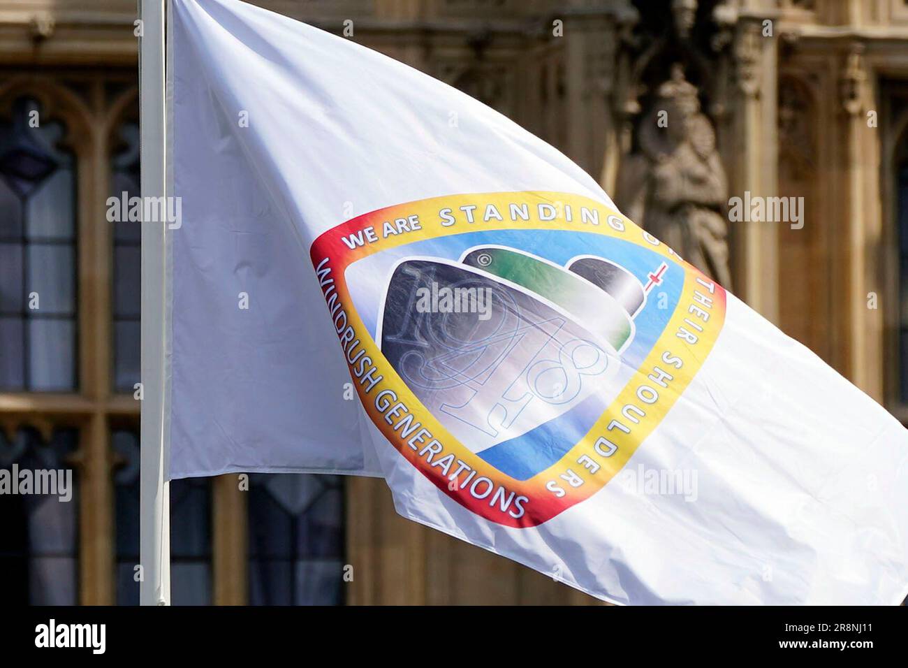 The Windrush flag flies at the Houses of Parliament, Westminster, London, marking the 75th anniversary of the arrival of the HMT Empire Windrush ship in Tilbury, Essex, carrying Caribbean families to the UK to help fill post-war labour shortages. Picture date: Thursday June 22, 2023. Stock Photo