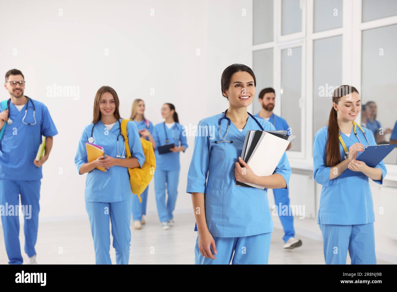 Group of medical students in college hallway Stock Photo